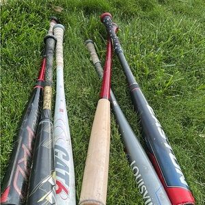 Assorted Baseball Bats with Red and Black Accents